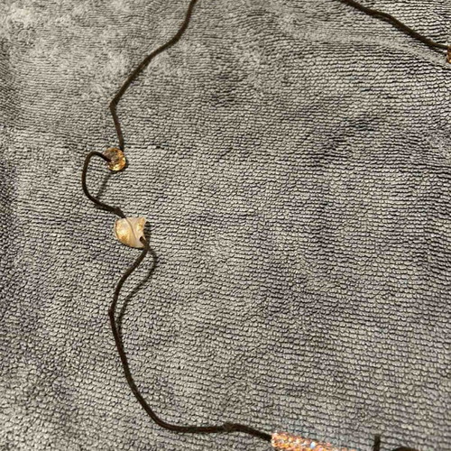 Necklace with brown leather cord and pink beads used