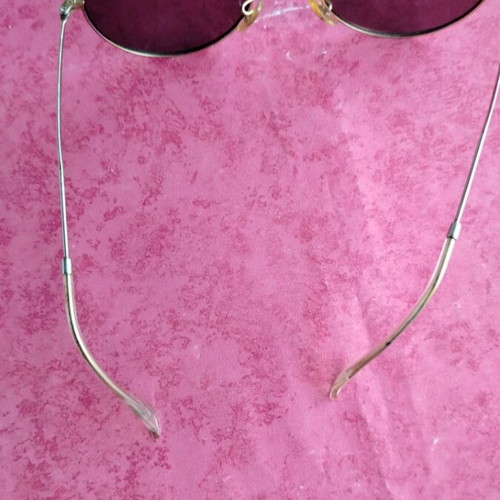 Round sunglasses with green mirrored lenses used, gold frame