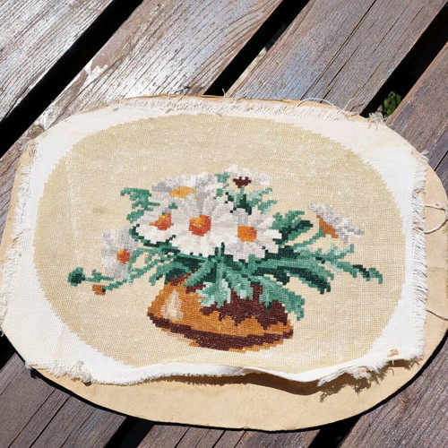 Vintage needlepoint with embroidered daisy bouquet used