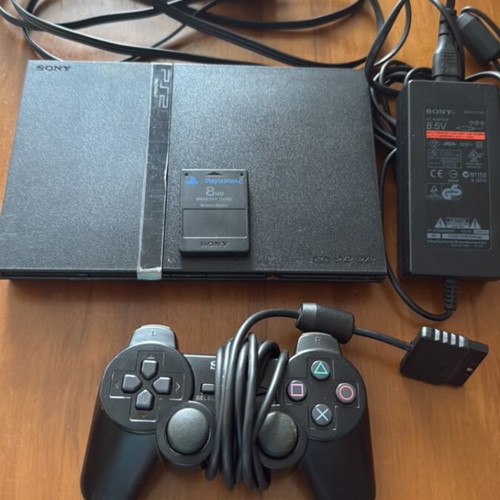 PlayStation 2 Slim console with original Sony accessories