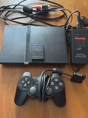 PlayStation 2 Slim console with original Sony accessories