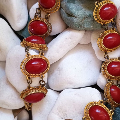 Vintage necklace used with red stones and brass metal