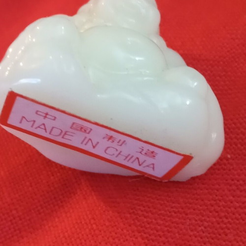 Alabaster-style miniature Buddha, smiling