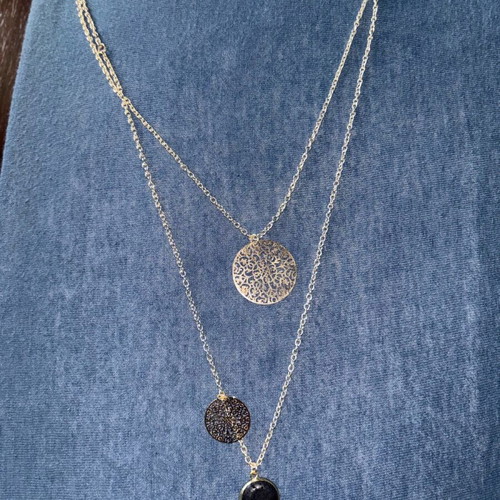 Gold pendant with black stone like new made of stainless steel