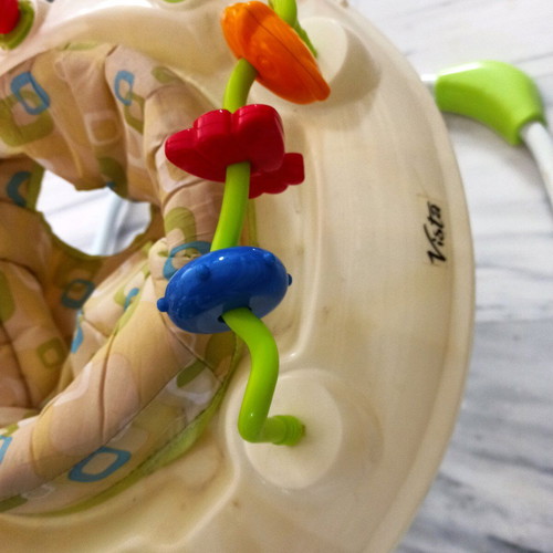 Baby jumper like new with colorful toys and 360-degree rotation