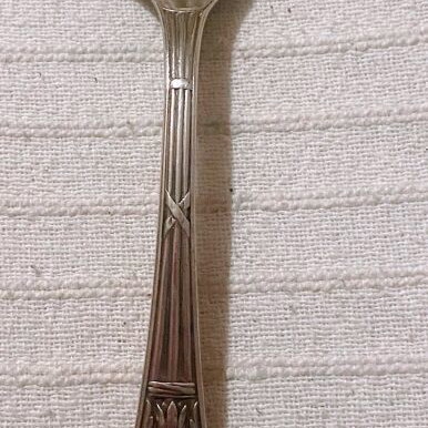 Vintage silver-plated food fork used with embossed decoration