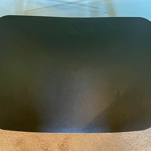Low stool like new with black curved plastic seat and wooden legs