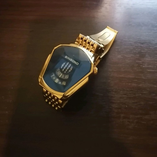 Binbond men's watch like new, gold color bracelet