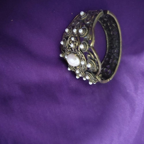 Bracelet with various designs and stones, like new