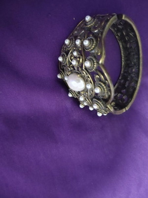 Bracelet with various designs and stones, like new