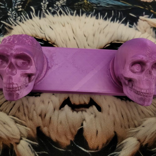 Wall hanger with skull design