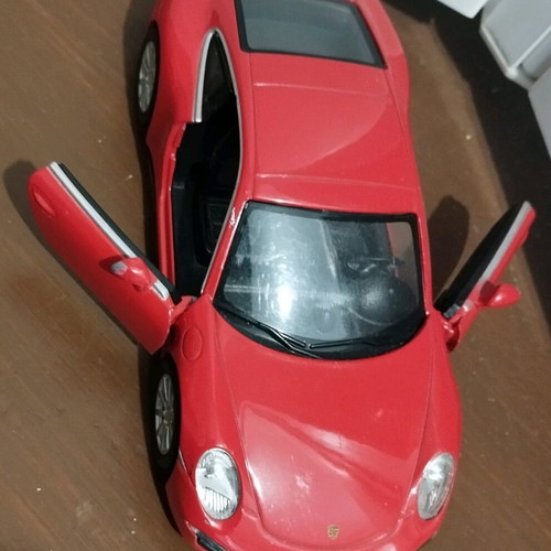 Collectible Porsche Carrera toy car with opening doors like new