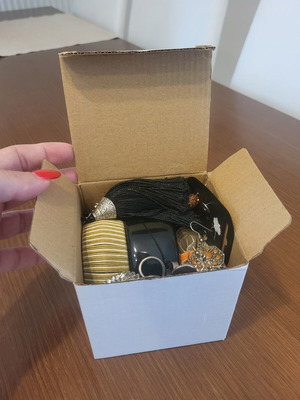 Jewelry box with bracelets, necklace, ring, earrings and belts