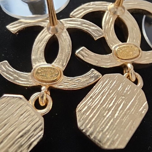 Chanel earrings with white and gold details