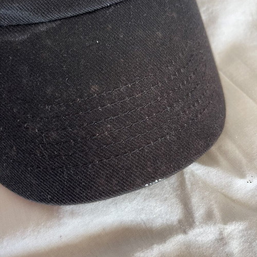 Magners cider branded hat used with small discoloration