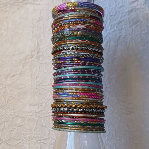 Indian glass bracelets like new, set of 54, colorful and decorated