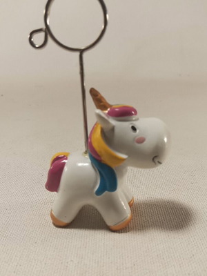 Table stand with unicorn design and metal clip