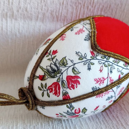 Geometric decorative egg used, red and floral design