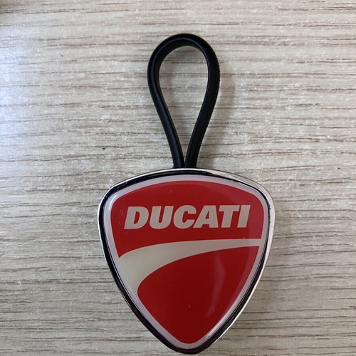 Ducati Official metal keychain with red and white enamel shield design