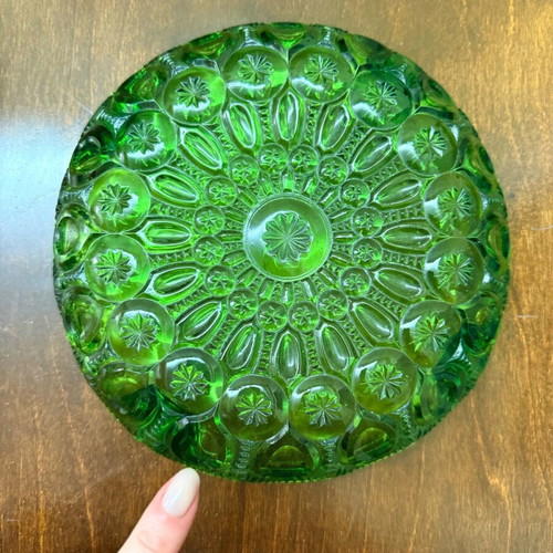 Green vintage glass plate used with embossed mid century design