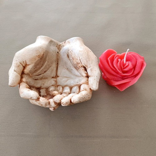 Decorative hands new, handmade art with candle heart rose