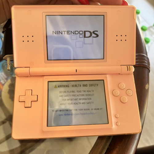 Nintendo DS used with 5 game cartridges and charger