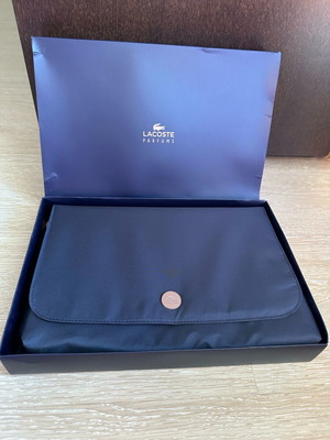 Lacoste blue hand pouch new with magnetic close
