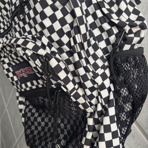 Jansport black and white checkerboard backpack with laptop compartment