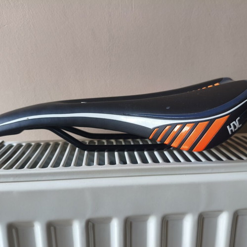 Bicycle saddle for MTB used, 300 grams, slight tear on right side