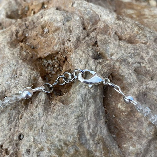 Bracelet with starfish and transparent beads, silver color