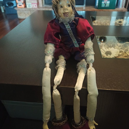 Wind-up Pierrot Harlequin doll used with music