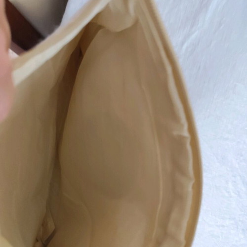 Handbag with eye design like new, beige