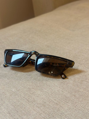 Sunglasses used with brown lens and tortoiseshell frame