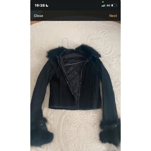 Short black reversible jacket with faux fur cuffs