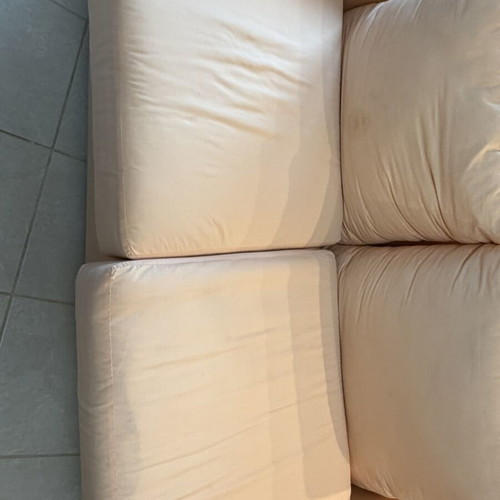 Fabric two-seater sofa used, light pink-peach with side cushions