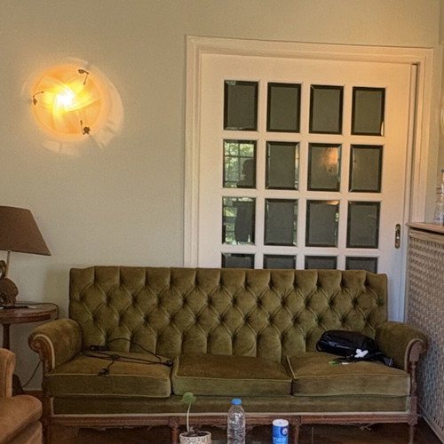 Brown sofa and green armchair furniture set