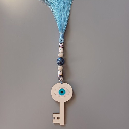 Key charm new with eye made of plexiglass and blue tassel