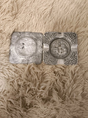 Vintage metal ashtrays used with embossed decorative design
