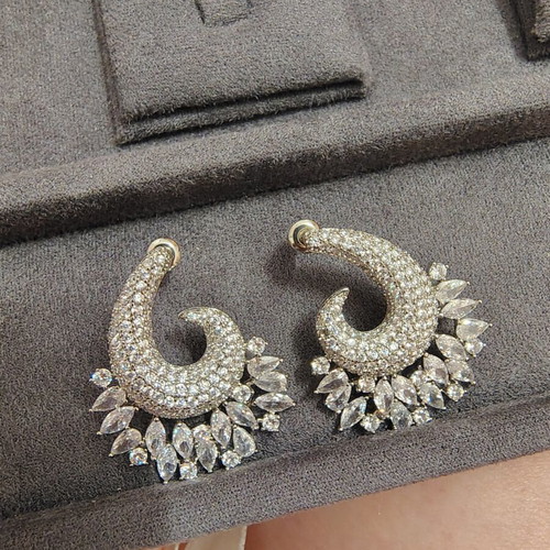 Earrings like new with zircon stones, silver color