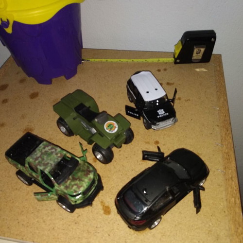 Sand bucket used with shovel, rake and 4 toy cars