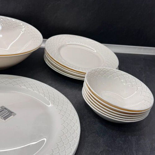 Porcelain dinnerware set with embossed design, like new