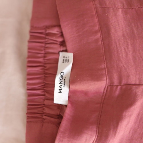 High-waisted pants used, satin fabric
