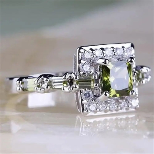 Ring with peridot and white zirconia new, silver plated metal
