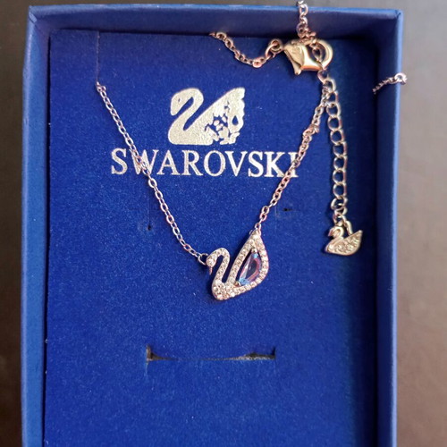 Swarovski necklace original, like new, silver color