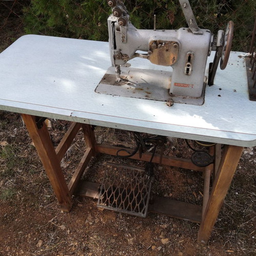 Sewing machines used with complete table