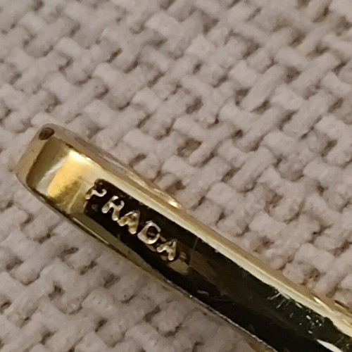 Authentic Prada gold key ring unisex like new