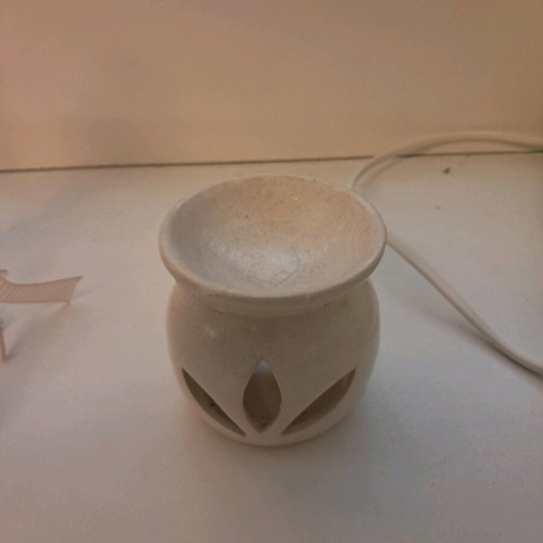 Clay container for liquid room fragrance used