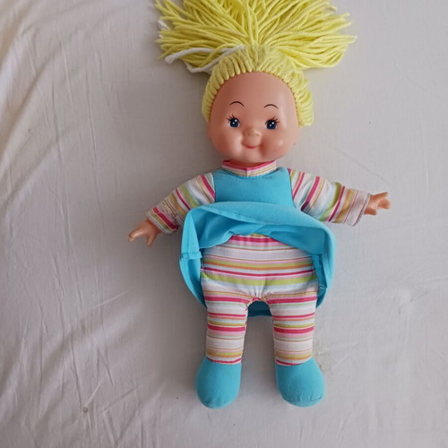 Doll with blonde yarn hair like new, soft body