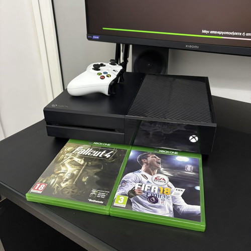 Xbox One 1TB console used with controller and 2 games