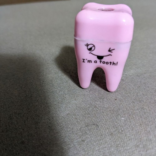 Children's tooth-shaped sharpener used, pink
